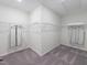 A spacious walk-in closet provides ample storage with wire shelving and carpet flooring at 1205 Coral Cay Bnd, Wake Forest, NC 27587