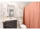 Bright bathroom with a modern vanity, fresh white towels, and a decorative shower curtain at 121 Black Oak Ct, Clayton, NC 27520