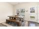 Bright dining area featuring a rustic wooden table and bench seating under a window at 121 Black Oak Ct, Clayton, NC 27520