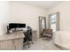 Well-lit home office with desk, chair, and large monitor setup, creating an ideal workspace at 121 Black Oak Ct, Clayton, NC 27520