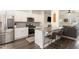 Modern kitchen featuring stainless steel appliances, granite countertops, a breakfast bar, and an open layout at 121 Black Oak Ct, Clayton, NC 27520