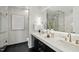 Elegant bathroom featuring a double vanity, marble accents, and modern fixtures at 122 N Harrington St # 1025, Raleigh, NC 27603