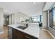 Modern kitchen with an undermount sink and countertop, open to living area, perfect for seamless entertaining at 122 N Harrington St # 1025, Raleigh, NC 27603