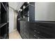Spacious walk-in closet with custom shelving, drawers, and ample storage space at 122 N Harrington St # 1025, Raleigh, NC 27603