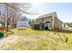 Large backyard with a covered patio perfect for outdoor entertaining and play at 131 Tracker Ct, Garner, NC 27529