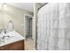 Bathroom with a white shower curtain and double sink vanity with lots of counter space at 131 Tracker Ct, Garner, NC 27529