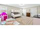 Bright bedroom with a bunk bed, carpeted floor and multiple windows for natural light at 131 Tracker Ct, Garner, NC 27529