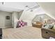 Spacious bonus room/playroom with carpeted floors and comfortable seating at 131 Tracker Ct, Garner, NC 27529