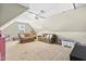 Spacious bonus room/playroom with carpeted floors and two sofas at 131 Tracker Ct, Garner, NC 27529