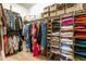 Walk-in closet with ample shelving and hanging storage for clothing and accessories, creating an organized space at 131 Tracker Ct, Garner, NC 27529