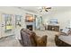 Inviting living room with a fireplace, comfortable recliner, and a seamless transition to the outdoor patio at 131 Tracker Ct, Garner, NC 27529