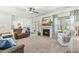 Spacious living room with a fireplace, comfortable seating, and ample natural light at 131 Tracker Ct, Garner, NC 27529
