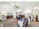 Cozy living room featuring neutral walls, plush carpeting, and comfortable seating creating a relaxing atmosphere at 131 Tracker Ct, Garner, NC 27529