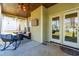 Inviting covered patio featuring a seating area, TV, and access to the outdoors at 131 Tracker Ct, Garner, NC 27529