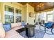 Relaxing outdoor patio with comfortable seating and a modern fire pit table at 131 Tracker Ct, Garner, NC 27529