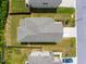 An aerial view shows the roof and backyard with green grass and a fence, surrounded by neighboring houses at 1401 Wrenn Rd, Durham, NC 27703