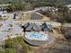 Aerial view of a community center featuring an outdoor pool and scenic landscaping at 1401 Wrenn Rd, Durham, NC 27703