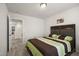 Comfortable bedroom with carpet, neutral walls, and natural light at 1401 Wrenn Rd, Durham, NC 27703