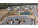 Aerial view of community amenities including tennis court, playground, and parking at 1401 Wrenn Rd, Durham, NC 27703