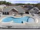 Spacious community pool, including a lounge area and tables and chairs at 1401 Wrenn Rd, Durham, NC 27703