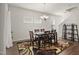 Cozy dining room with natural light, a patterned rug, and seating for six at 1401 Wrenn Rd, Durham, NC 27703