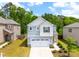 Charming two-story home with a two-car garage and manicured front lawn at 1401 Wrenn Rd, Durham, NC 27703