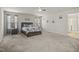 Spacious main bedroom with carpeting, ceiling fan, and and bedside tables at 1401 Wrenn Rd, Durham, NC 27703