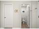 Clean powder room with a view to the toilet and another doorway at 1401 Wrenn Rd, Durham, NC 27703
