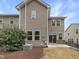 Two-story home exterior with neutral siding, a small yard, and back patio for outdoor entertaining at 1419 Glenwater Dr, Cary, NC 27519