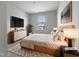Bright bedroom with a large window, stylish furniture, and modern decor for a comfortable retreat at 1419 Glenwater Dr, Cary, NC 27519