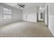 Large, carpeted bonus room with a ceiling fan, and a window offering ample natural light at 1419 Glenwater Dr, Cary, NC 27519