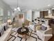 Living room with modern furniture, hardwood floors, and an adjacent open kitchen at 1419 Glenwater Dr, Cary, NC 27519