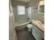 Clean bathroom with tub and shower combination, updated vanity, and stylish flooring at 167 Spaulding Dr, Rocky Mount, NC 27801
