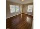 Bedroom with natural light, hardwood floors, and neutral paint; move-in ready at 167 Spaulding Dr, Rocky Mount, NC 27801
