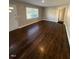Bright living room featuring refinished hardwood floors, neutral walls and natural light at 167 Spaulding Dr, Rocky Mount, NC 27801