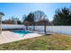 Backyard pool and pergola area with hammocks surrounded by landscaping at 174 Coalyard Dr, Garner, NC 27529