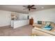 Bonus room featuring sectional sofa, wooden cabinets and view of main bedroom at 174 Coalyard Dr, Garner, NC 27529
