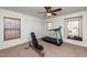Bright bonus room featuring exercise equipment and large windows offering natural light at 174 Coalyard Dr, Garner, NC 27529