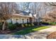 Charming clubhouse with brick accents, a clock tower, well-maintained landscaping, and inviting entrance at 174 Coalyard Dr, Garner, NC 27529