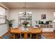 Bright dining area with table, view to outdoor seating, and natural light at 174 Coalyard Dr, Garner, NC 27529