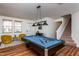 Spacious game room with a pool table, lots of natural light, and stairs to the next floor at 174 Coalyard Dr, Garner, NC 27529