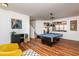 Well-lit game room featuring a pool table, stylish art, and modern furniture at 174 Coalyard Dr, Garner, NC 27529
