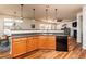Kitchen area featuring wood cabinets, black dishwasher, and eat-in bar at 174 Coalyard Dr, Garner, NC 27529