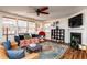 Comfortable living room featuring a fireplace, modern decor, and lots of light at 174 Coalyard Dr, Garner, NC 27529