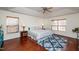 Serene main bedroom with tray ceilings, wood floors, and ambient lighting at 174 Coalyard Dr, Garner, NC 27529