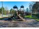 Community playground with slides and climbing structures for children at 174 Coalyard Dr, Garner, NC 27529