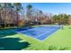 Community tennis court and playground with landscaping at 174 Coalyard Dr, Garner, NC 27529