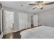 Comfortable bedroom featuring a ceiling fan and closet space with an open view to the en-suite bathroom at 202 Brook Ln, Durham, NC 27712