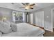 Bright bedroom with a large window, plush pillows, and ample closet space at 202 Brook Ln, Durham, NC 27712