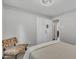 Bedroom with a patterned accent chair and neutral walls. Ample closet space available at 202 Brook Ln, Durham, NC 27712